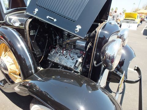 Flathead V8 engine in a black prewar Ford hot rod