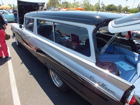 Black and silver 1950s station wagon, rear three-quarter view