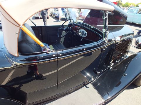 Black vintage roadster interior with tan top and tan leather seats