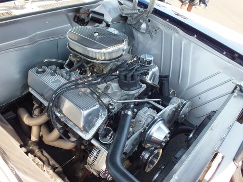 V8 engine with chrome oval air cleaner in an engine bay