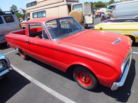 Red Ford Falcon Ranchero coupe-utility with red steel wheels at a car show