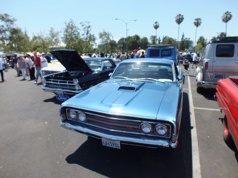 Light blue Ford coupe-utility front with hood scoop and Ford grille at show