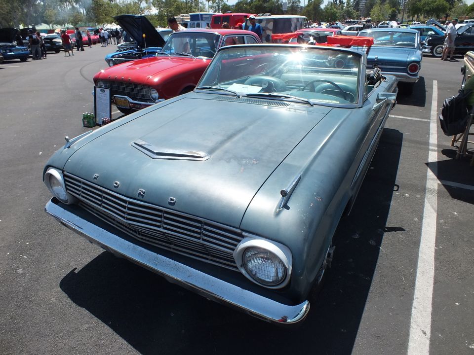 Faded blue Ford Falcon convertible with FORD hood lettering, front view