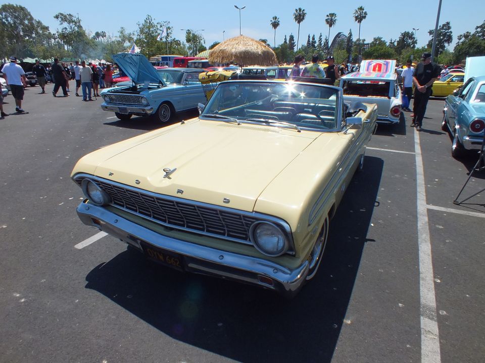 Front of cream Ford convertible with FORD lettered grille at a car show