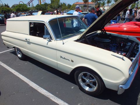 Cream classic panel delivery van with hood up at a car show