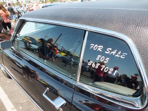 Black car rear side window with hand-painted FOR SALE 805 368 7021 sign