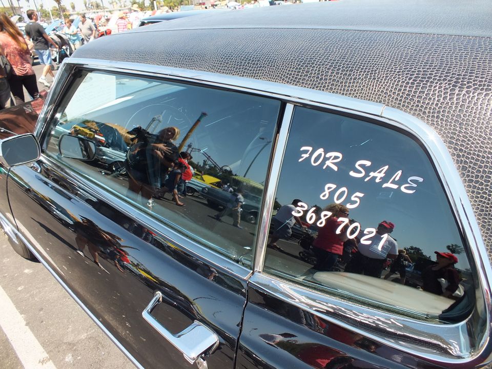 Black car rear side window with hand-painted FOR SALE 805 368 7021 sign