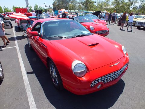 Red Ford Thunderbird convertible front three-quarter at a car show