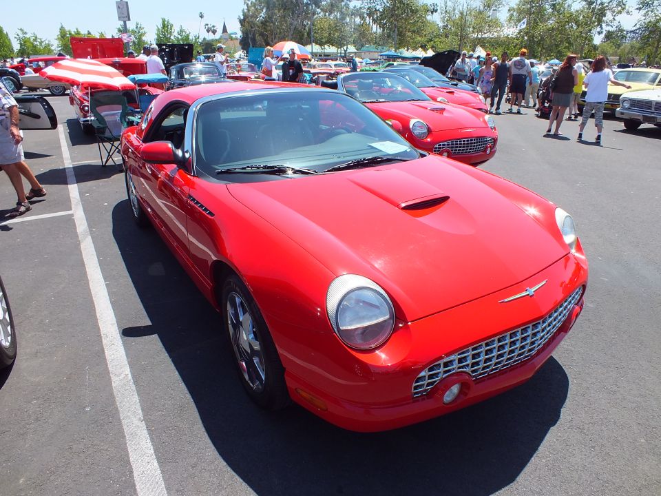 Red Ford Thunderbird convertible front three-quarter at a car show