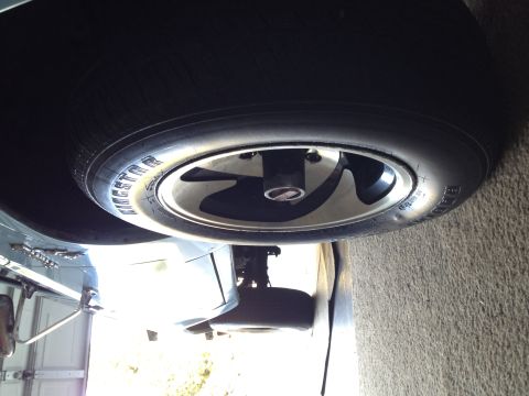 1985 Ford Bronco II - Close-up view of a spare tire and wheel, showing the tire's sidewall markings.