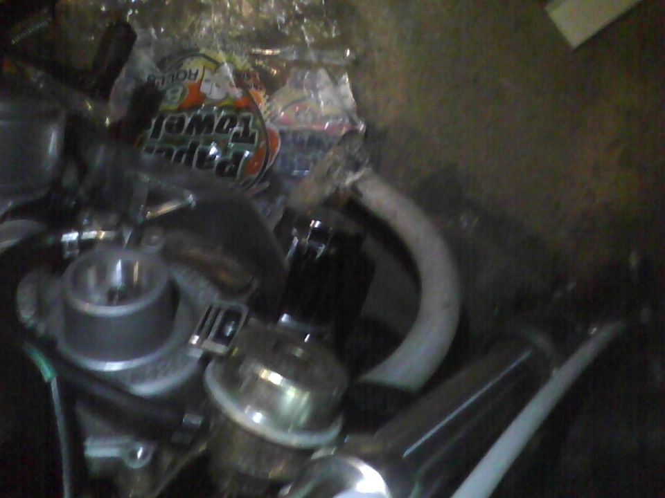 Engine parts with a roll of paper towels