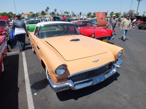 Tan two-tone Ford Thunderbird hardtop with porthole roof at a car show