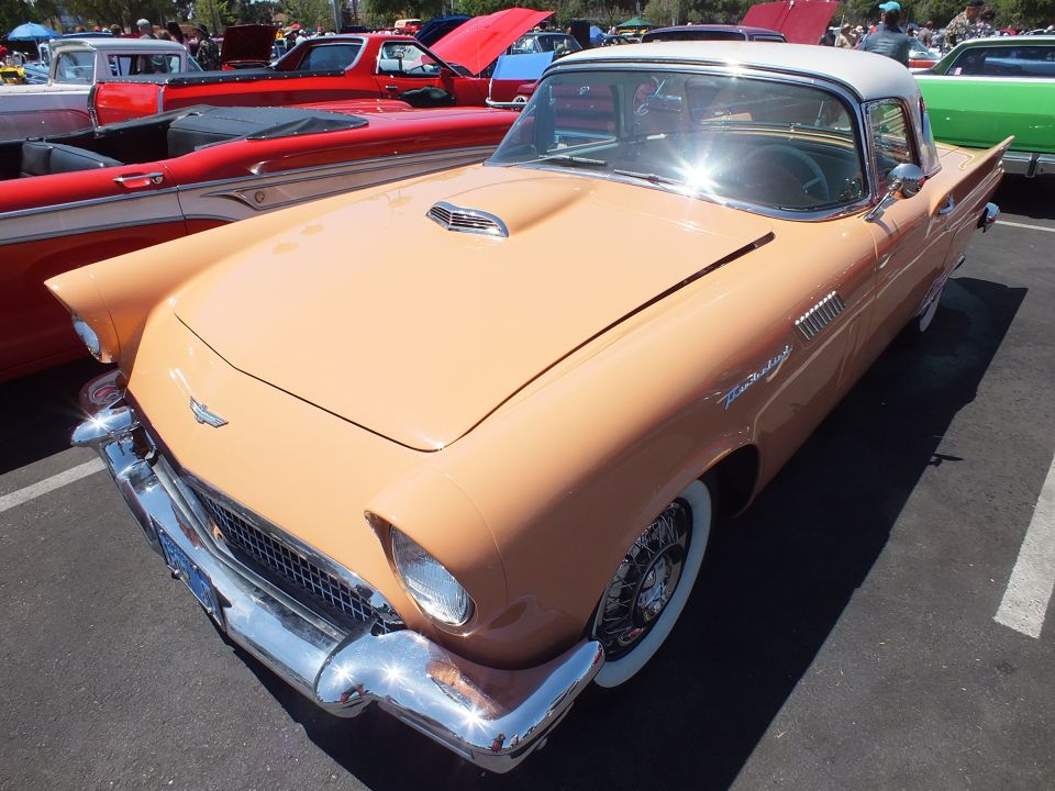 Tan Ford Thunderbird with white hardtop and wire wheels at a car show