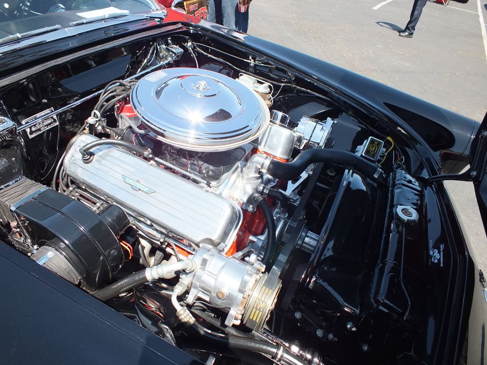 Chrome-topped V8 engine in the bay of a classic Ford Thunderbird