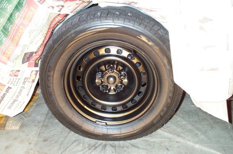 1998 Ford Crown Victoria - The wheels were pretty scratched up from having the hubcaps removed and installed frequently. Therefore, they had to be stripped, primered,…