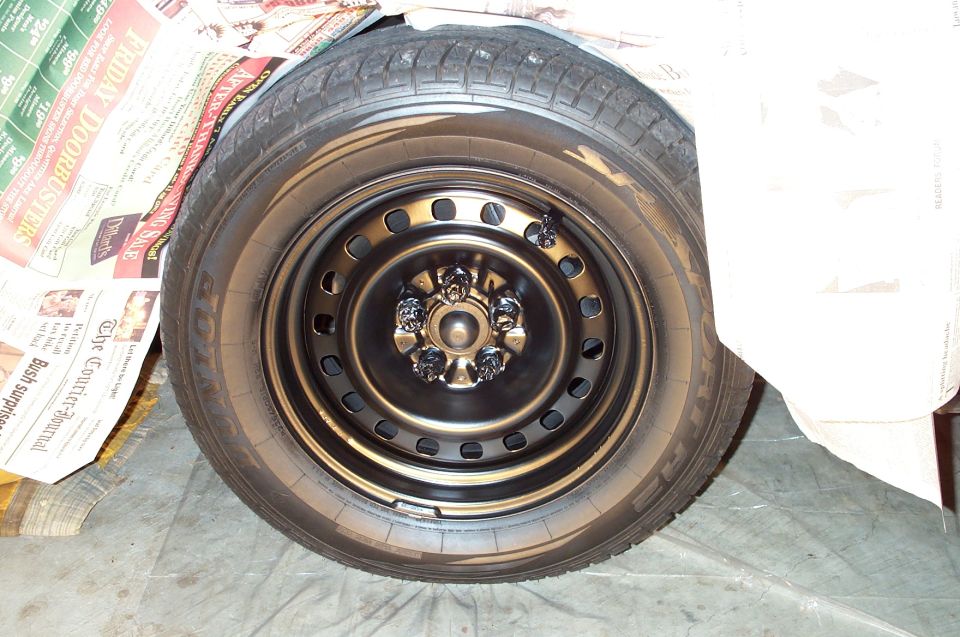 The wheels were pretty scratched up from having the hubcaps removed and installed frequently. Therefore, they had to be stripped, primered, and repainted.