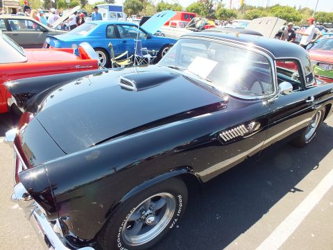 Black Ford Thunderbird hardtop rear quarter with raised-letter tires