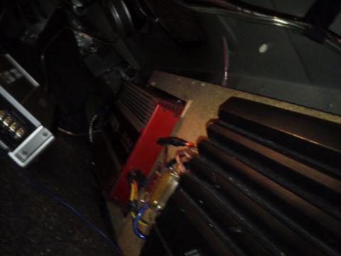 2000 Mercury Grand Marquis - Multiple car audio amplifiers and associated wiring are visible in this image.