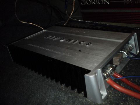 2000 Mercury Grand Marquis - A car amplifier with visible wiring and a brand logo is shown.