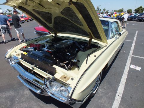 Cream Ford Thunderbird front with open hood and engine