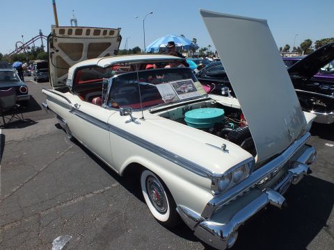 White 1959 Ford convertible with hood and trunk open at car show