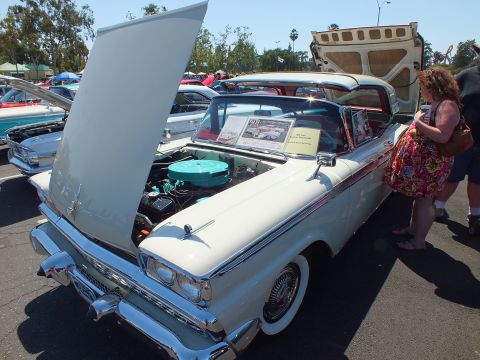 White Ford Fairlane convertible front with hood up and teal air cleaner