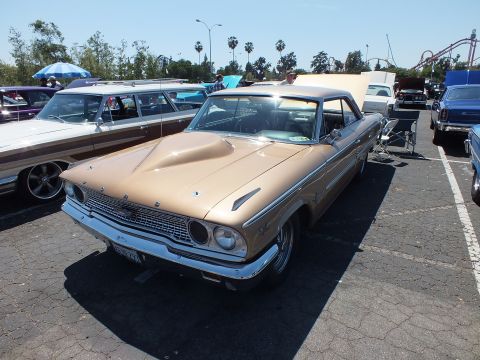 Gold 1963 Ford Galaxie hardtop front three-quarter view at car show
