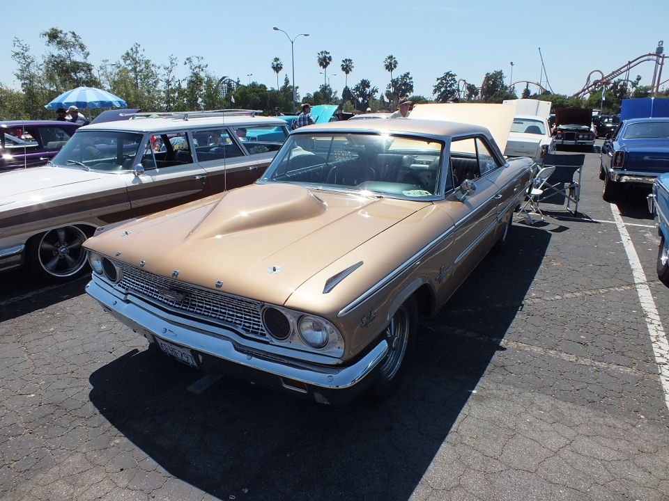 Gold 1963 Ford Galaxie hardtop front three-quarter view at car show