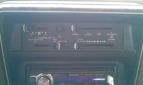 1987 Ford Bronco - The climate control panel shows settings for fan speed, vent selection, and temperature.
