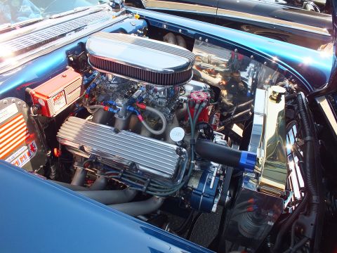 Close-up of chromed V8 engine with finned valve covers and MSD ignition box