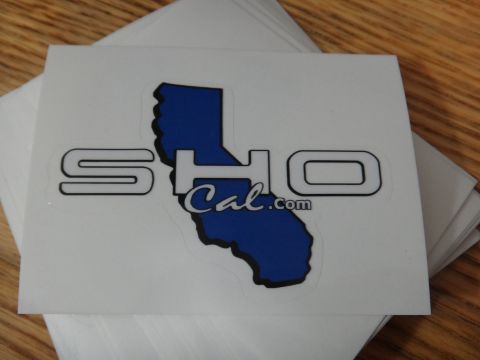 1995 Ford Taurus - A sticker with the text SHO Cal.com is shown on a stack of other stickers.