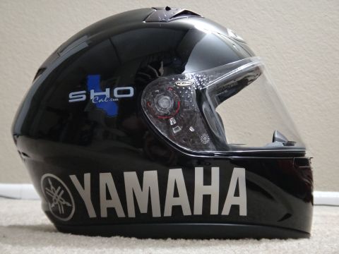 1995 Ford Taurus - This is a black Yamaha motorcycle helmet with a SHO Cal.com logo on the side.