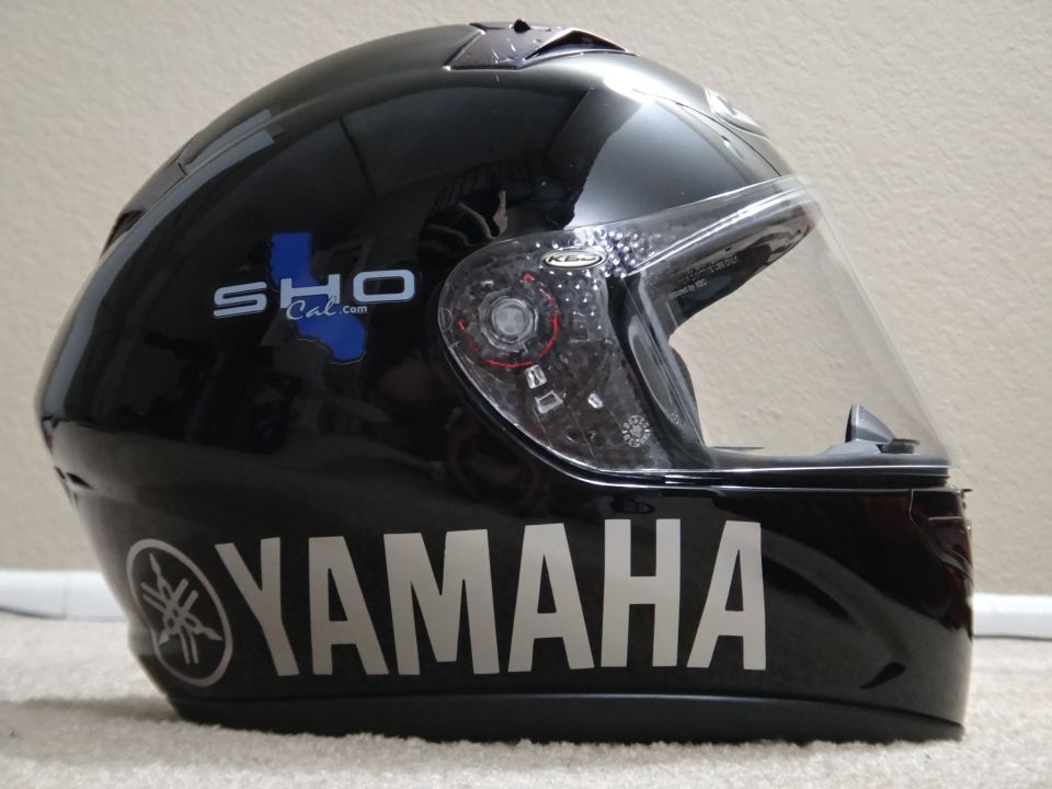 Black Yamaha motorcycle helmet with SHO Cal.com logo