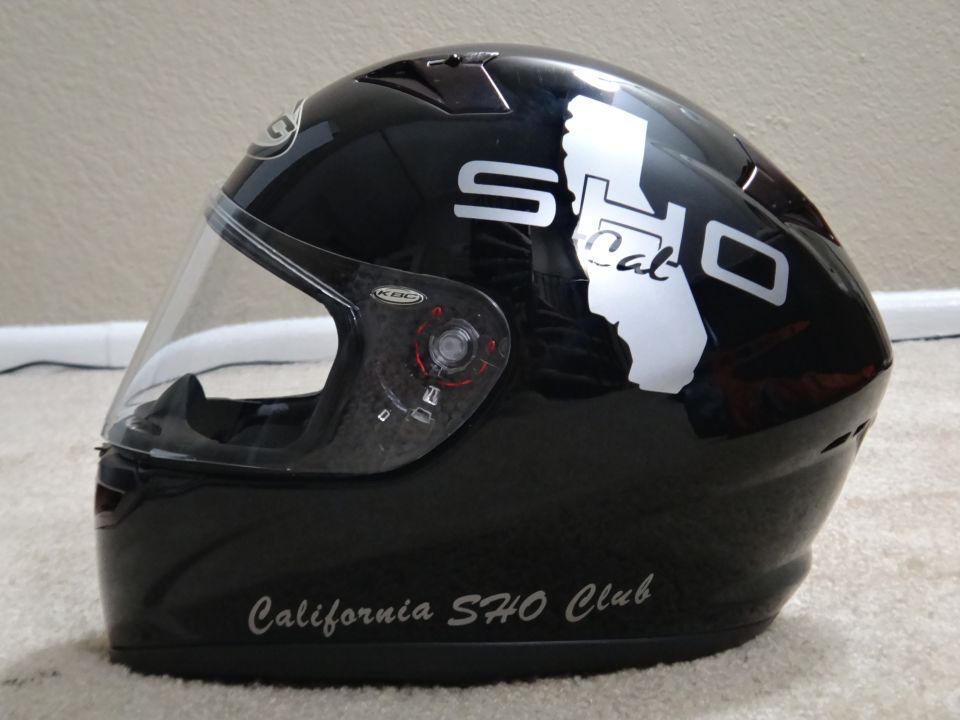 Black motorcycle helmet with SHO Cal graphic and California SHO Club text