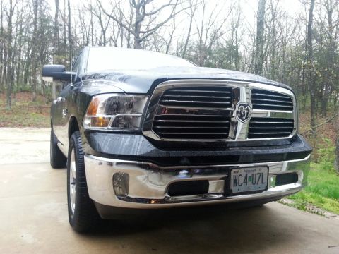 2007 Dodge Durango - Black Ram 1500 pickup truck front end with chrome grille and bumper. License plate is from Missouri.