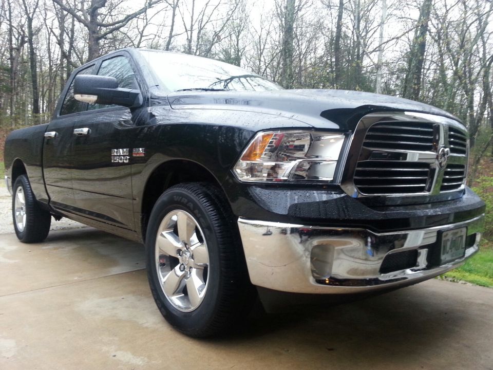Black Ram 1500 pickup truck parked outside