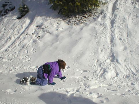1978 Ford Bronco - Child playing in the snow during winter.