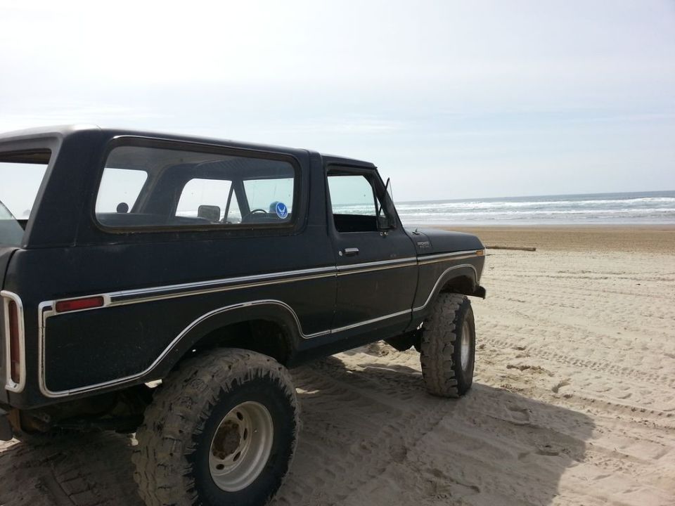 1979 Ford Bronco, black, 3q-front view, on a beach