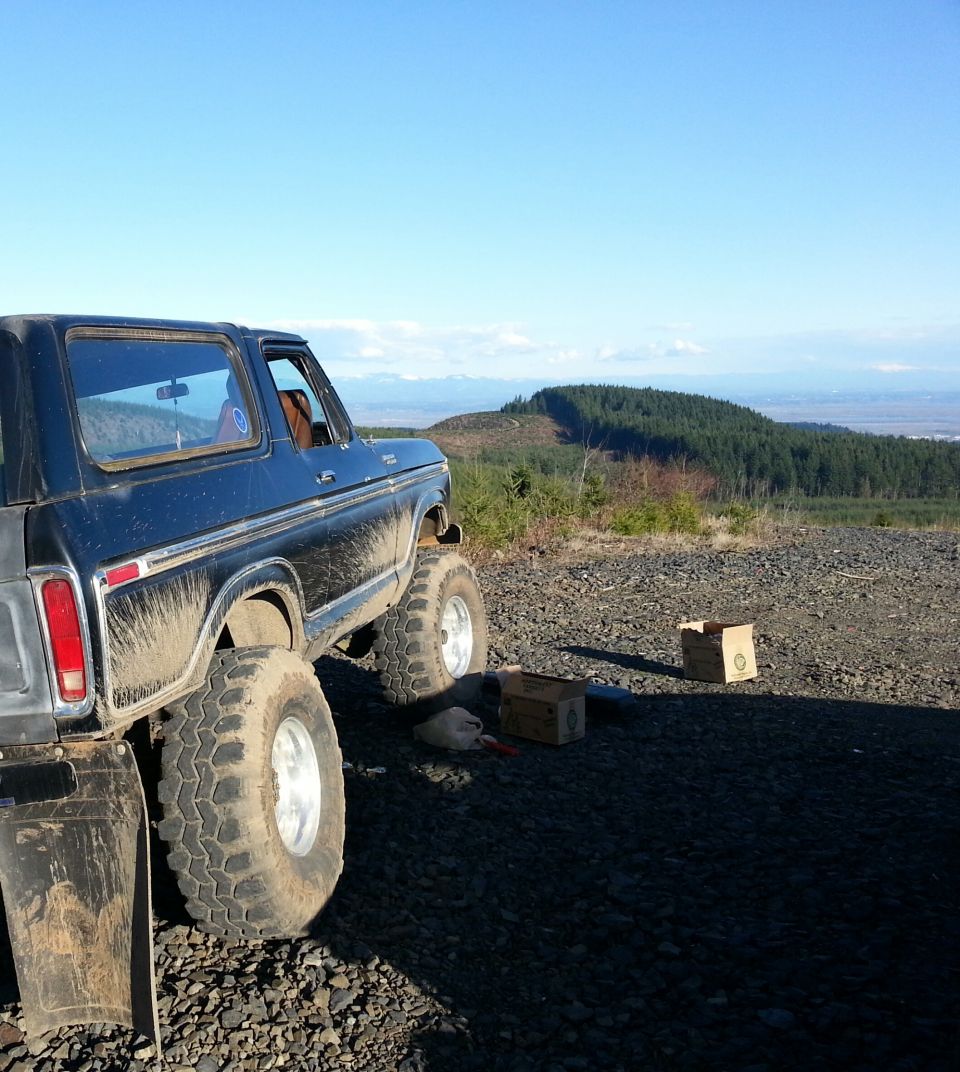 Black 1979 Ford Bronco, 3/4 front view, lifted with large tires