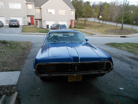 1968 Mercury Cougar - Front view of a blue 1968 Mercury Cougar parked in a driveway.