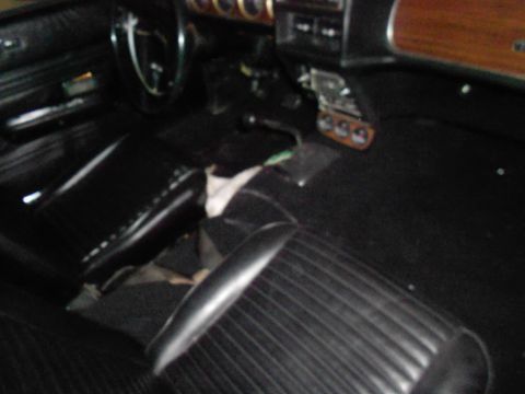 1968 Mercury Cougar - The interior of a car is shown, with a focus on the seats and dashboard area.