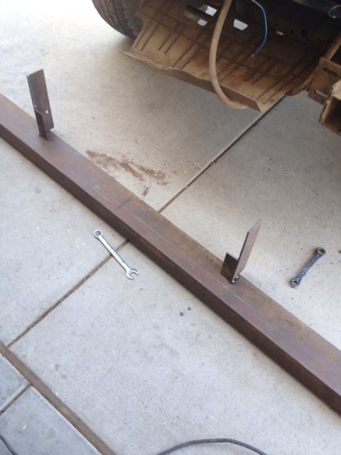 1995 Ford Bronco - Custom bumper fabrication in progress, with tools laid out on the concrete floor.