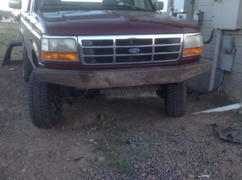 1995 Ford Bronco - Front view of a 1995 Ford Bronco, showing its grille and a custom bumper.