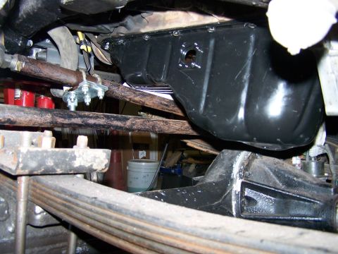 1988 Suzuki Samurai - Underside view of a vehicle's engine oil pan, leaf springs, and differential, likely part of a custom modification.