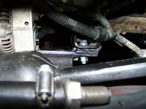 1988 Suzuki Samurai - Close-up of engine bay components, including alternator and mounting hardware.