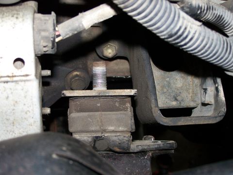 1988 Suzuki Samurai - This image shows a close-up view of a vehicle's engine mount, focusing on its rubber dampening component.