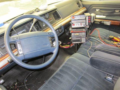 1991 Ford LTD Crown Victoria - Interior view of a 1991 Ford Crown Victoria LTD, equipped with multiple radio units and visible wiring.