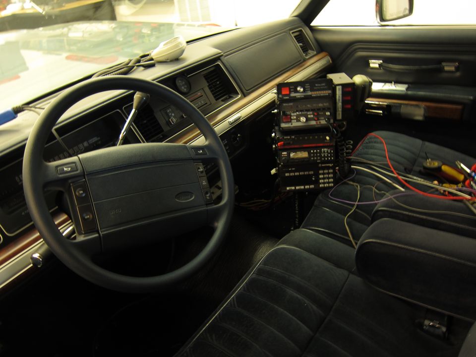 Interior view of car with stacked radio equipment and wiring