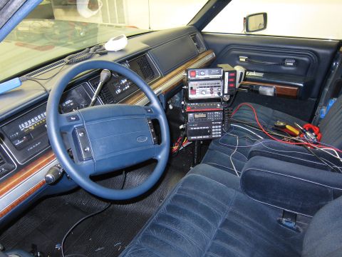 1991 Ford LTD Crown Victoria - Interior view of a 1991 Ford Crown Victoria LTD, equipped with several radio communication devices.