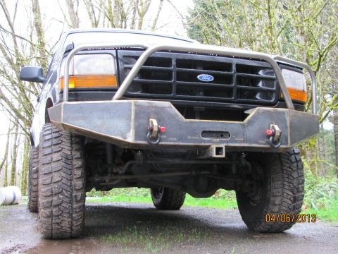 1989 Ford Bronco - This Ford Bronco features a heavy-duty aftermarket bumper and grille guard, ready for off-road adventures.